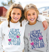 Thumbnail for Two young girls wearing matching sweatshirts with the text 