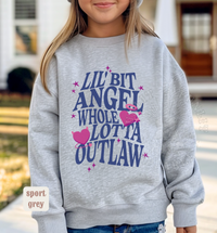 Thumbnail for A young girl wearing a grey sweatshirt with a graphic design featuring text and pink hearts.