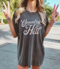 Thumbnail for A woman wearing a grey t-shirt with the text 