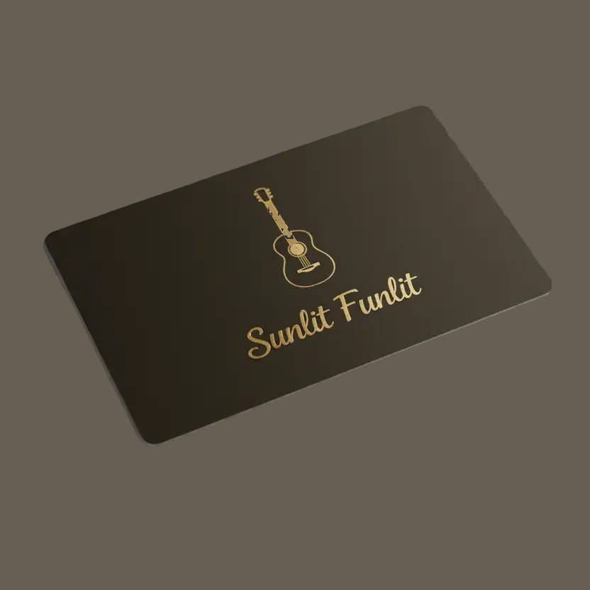 a black gift card with an emblem of a folk guitar and the words "Sunlit Funlit"