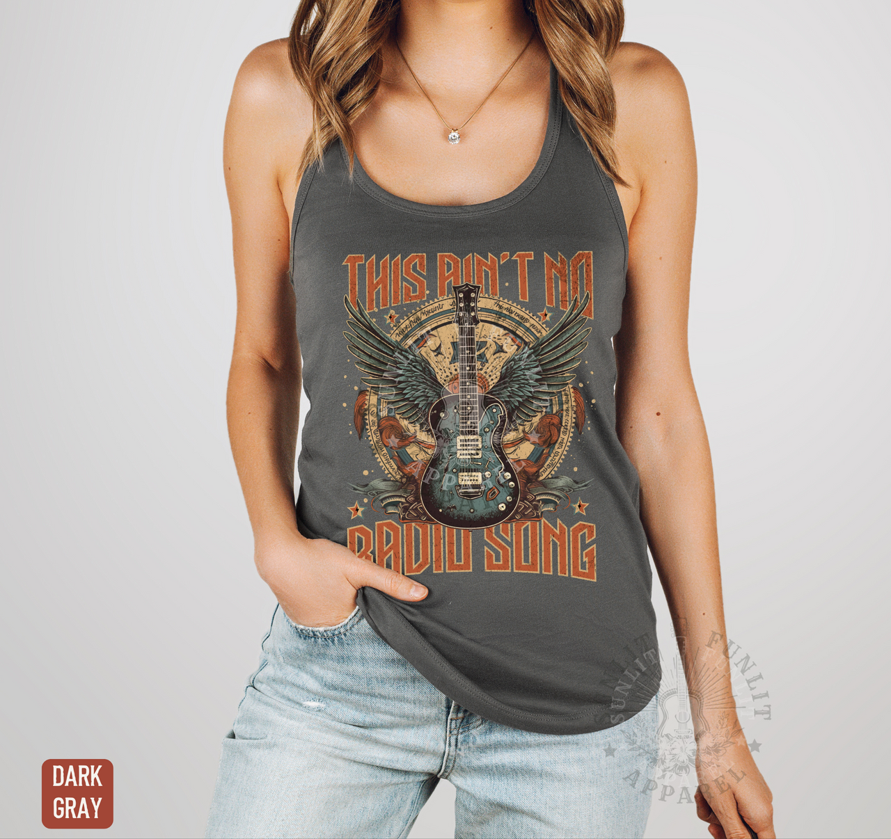 A woman wearing a gray tank top with a graphic design featuring a guitar and the text "This Ain't No RADIUS SONG" printed on it.
