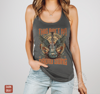 Thumbnail for A woman wearing a gray tank top with a graphic design featuring a guitar and the text 