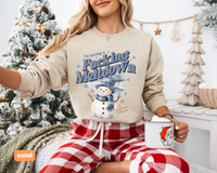 Thumbnail for A woman wearing a sweatshirt with a snowman graphic and the text 