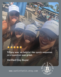 Thumbnail for A group of four women wearing matching white baseball caps with the word 