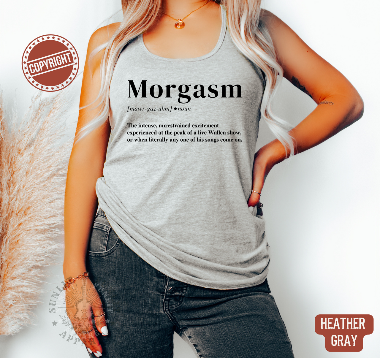 A woman wearing a gray tank top with the word "Morgasm" printed on it, standing against a white background.