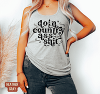 Thumbnail for Doin' Country Ass Shit Racerback Tank - Sunlit Funlit | Graphic Tees for Country Concert Addicts