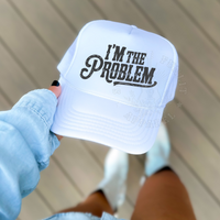 Thumbnail for A person is holding a white baseball cap with the text 
