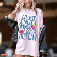 Thumbnail for A woman wearing a pink t-shirt with a graphic design and a denim jacket.