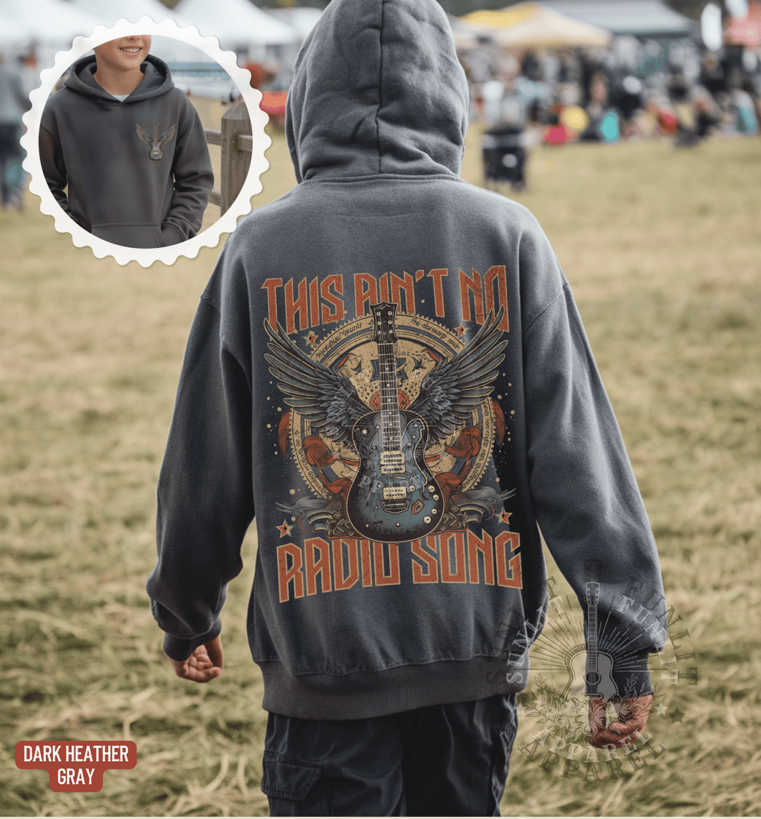 A person wearing a grey hoodie with a graphic design of a guitar and wings, along with the text "This Ain't No RADIO SONG" printed on the back.